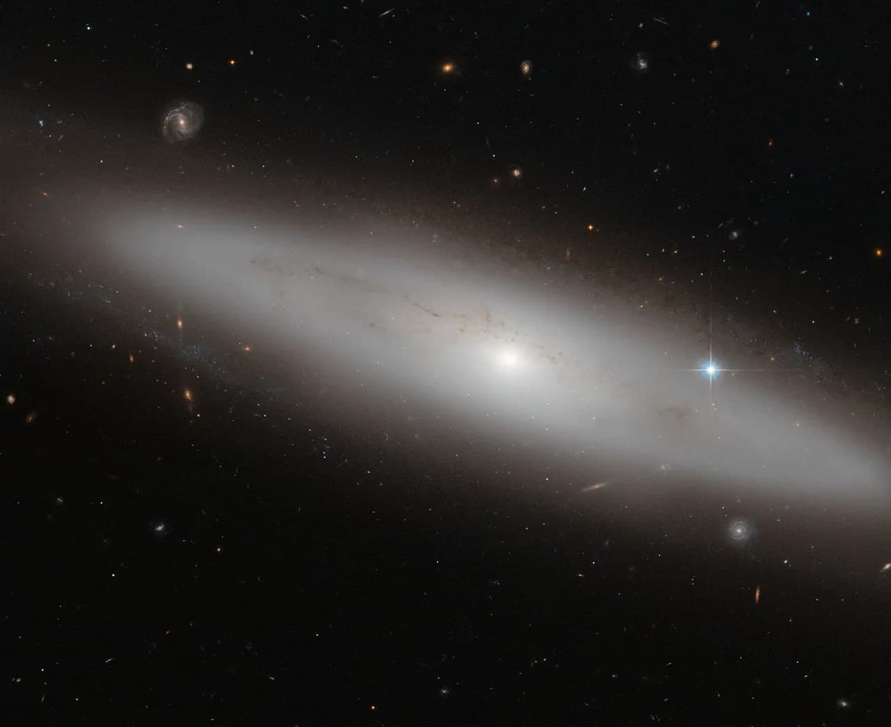 NASA’s Hubble Sees a Stranger in the Crowd