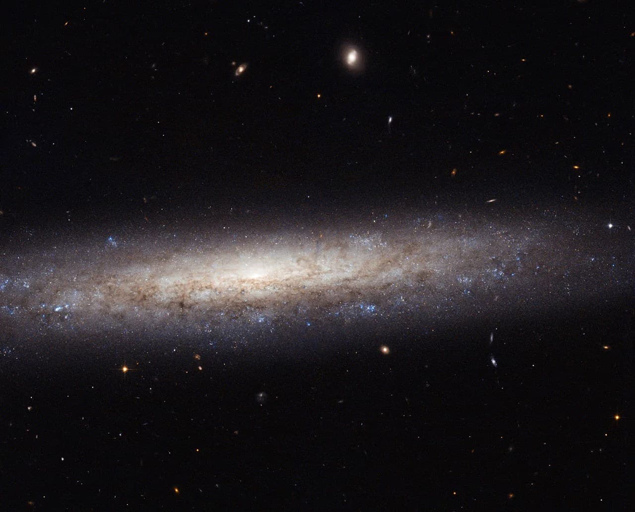 Hubble Catches a Dusty Spiral in Virgo