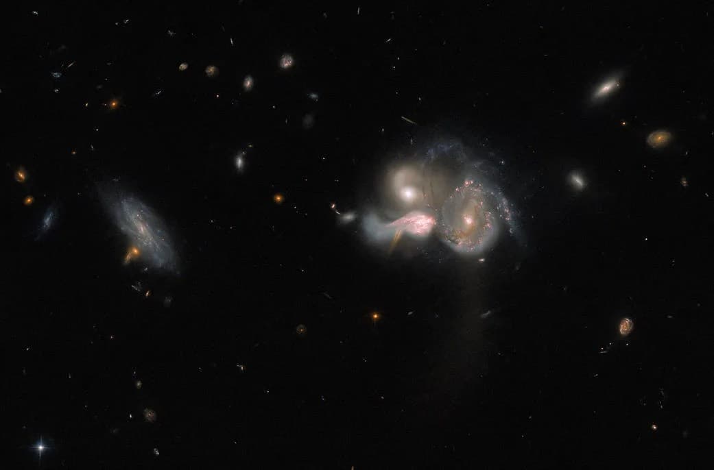 Hubble Views a Merging Galactic Trio