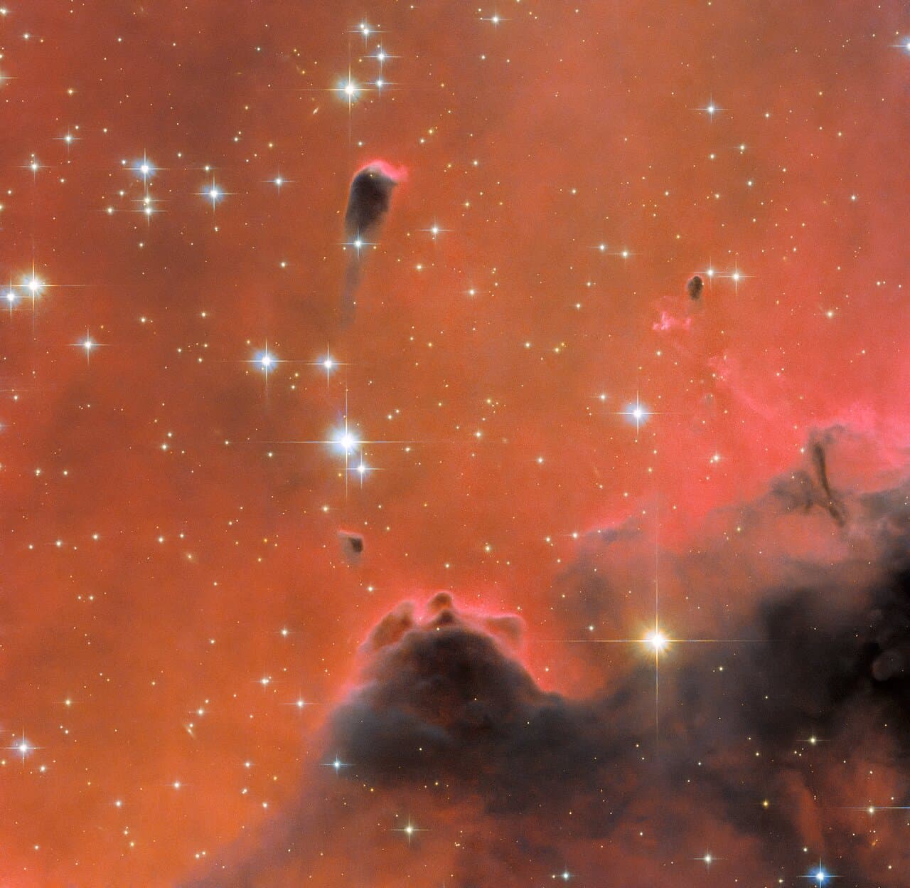 Hubble Views a Glistening Red Nebula