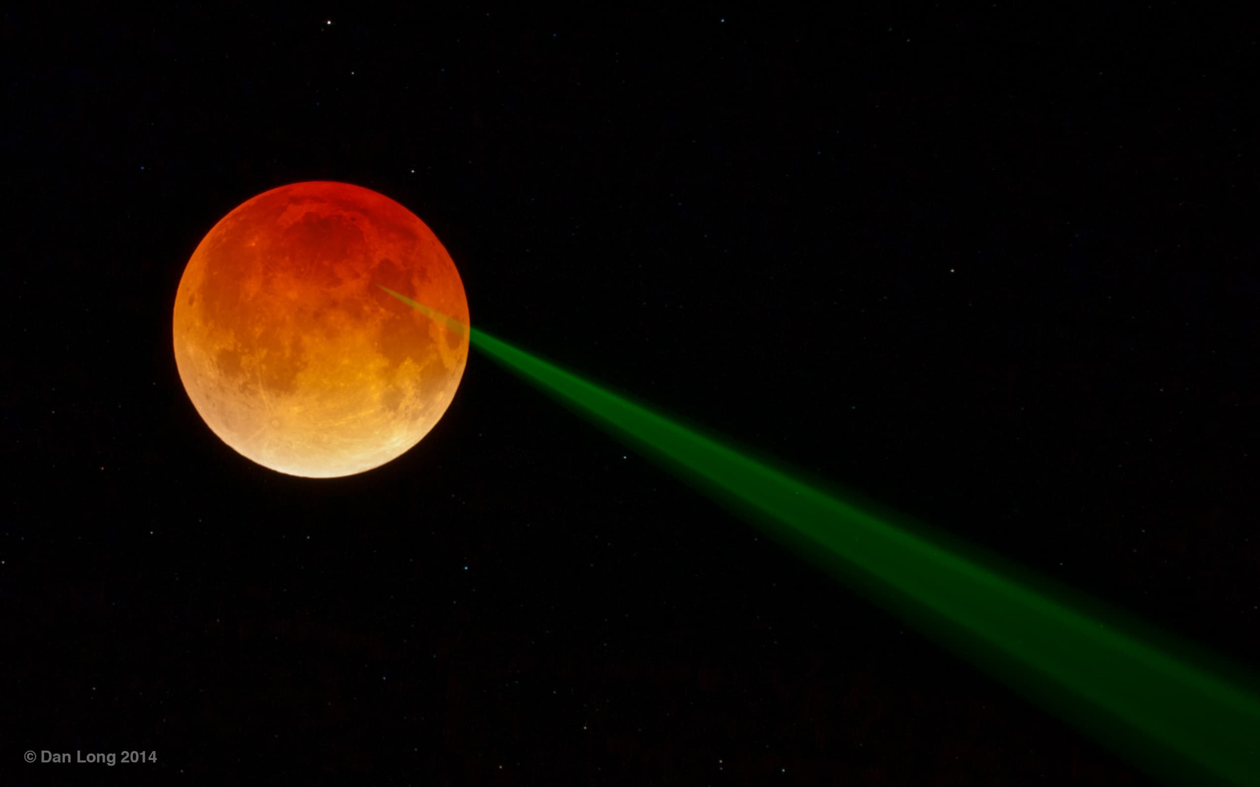 APOD: 2014 April 18 – Red Moon, Green Beam
