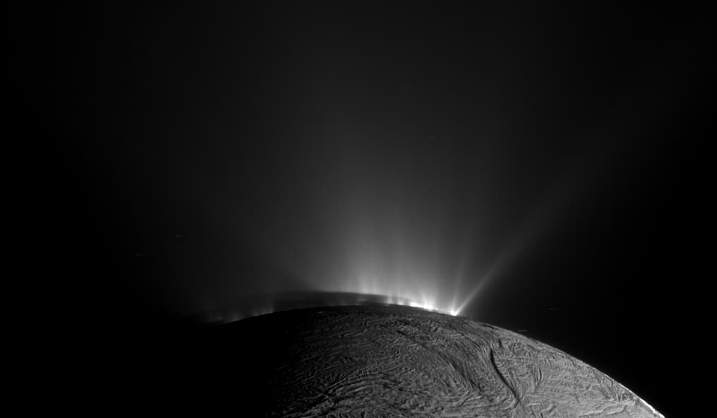 APOD: 2014 August 4 – Shadows and Plumes Across Enceladus