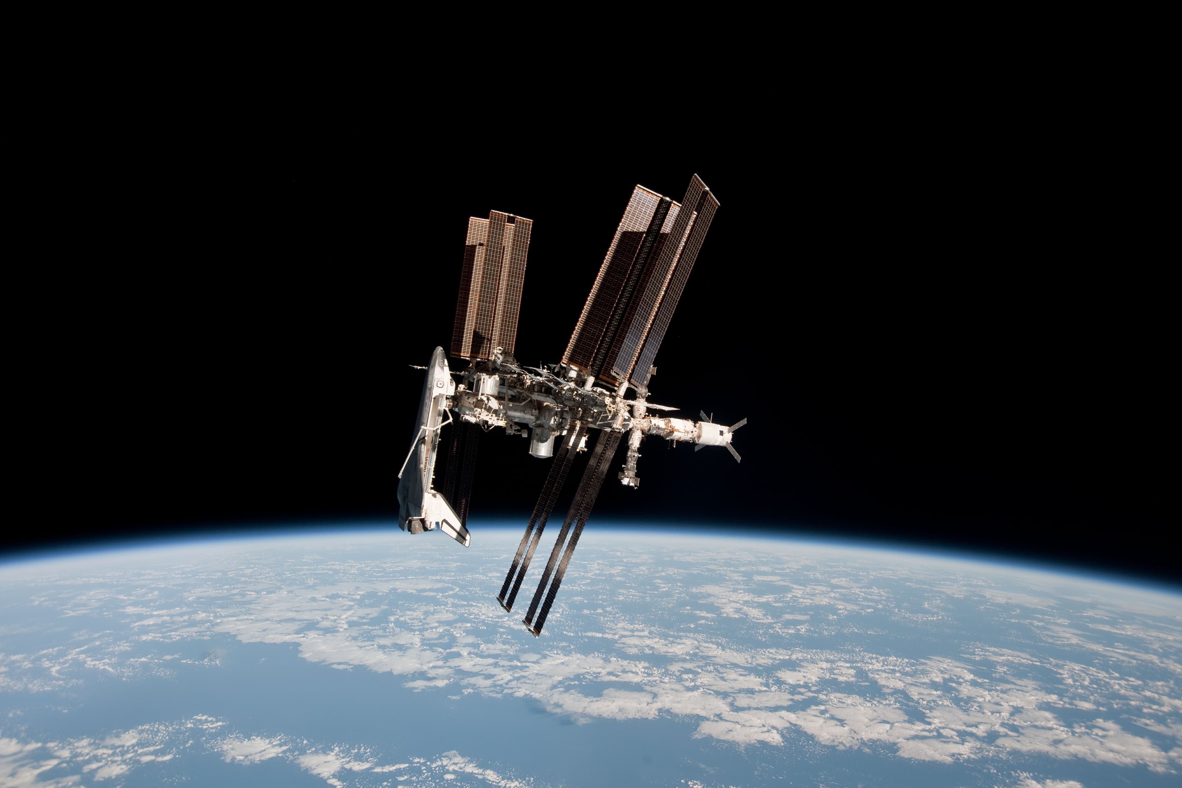 APOD: 2014 August 31 – Space Shuttle and Space Station Photographed Together