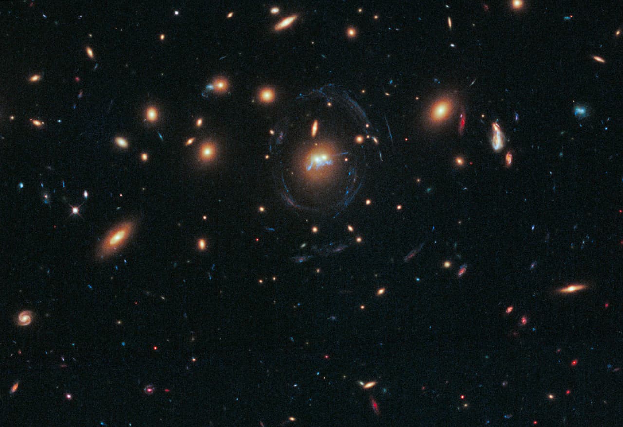 APOD: 2014 July 15 – A Blue Bridge of Stars between Cluster Galaxies