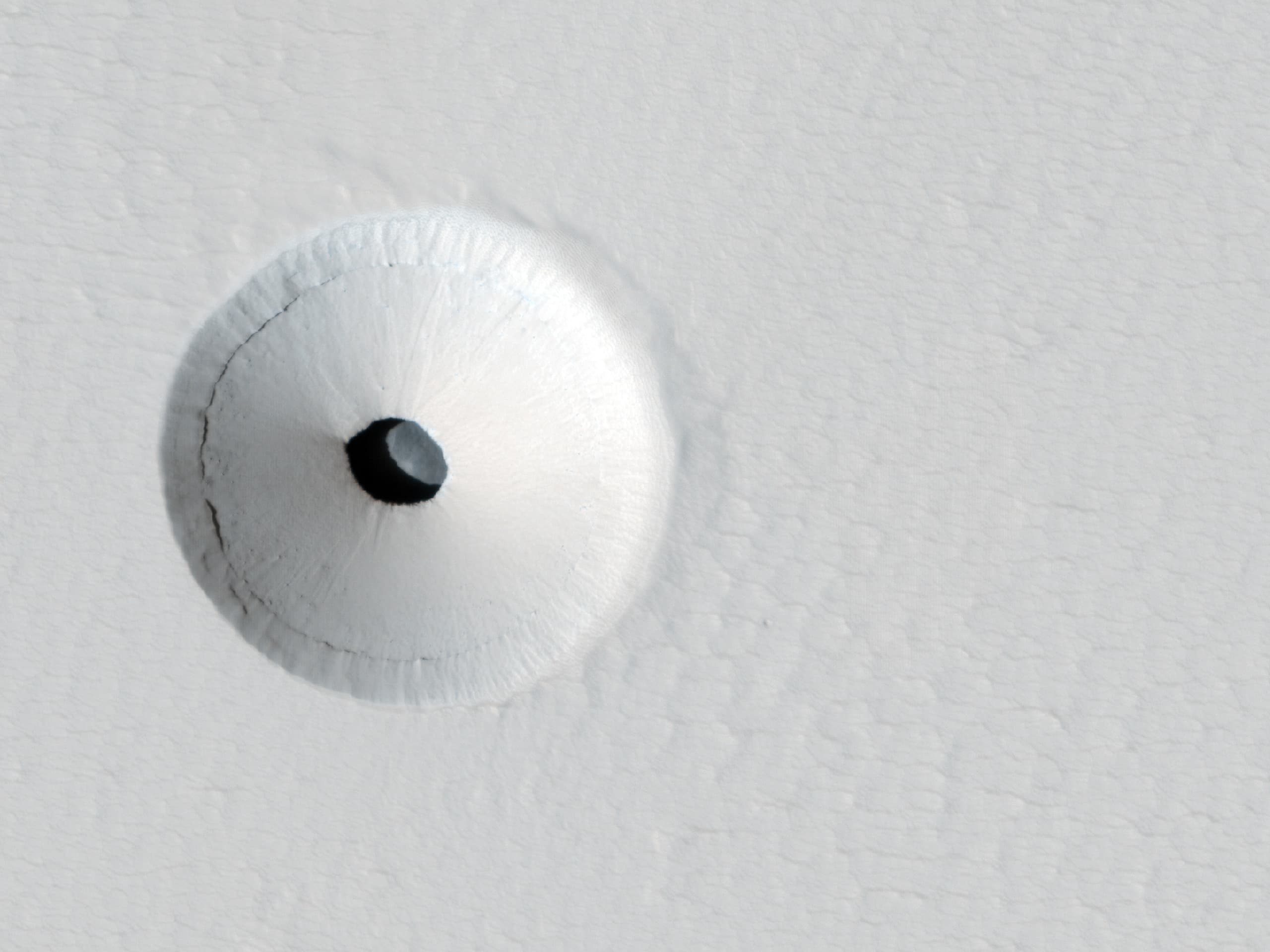 APOD: 2014 March 9 – A Hole in Mars