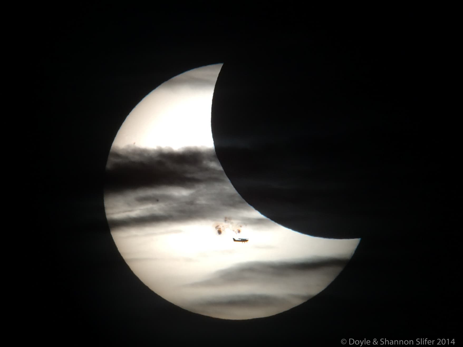 APOD: 2014 October 27 – Plane, Clouds, Moon, Spots, Sun