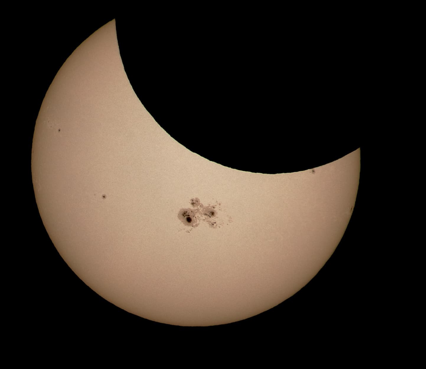 APOD: 2014 October 25 – Sunspots and Solar Eclipse