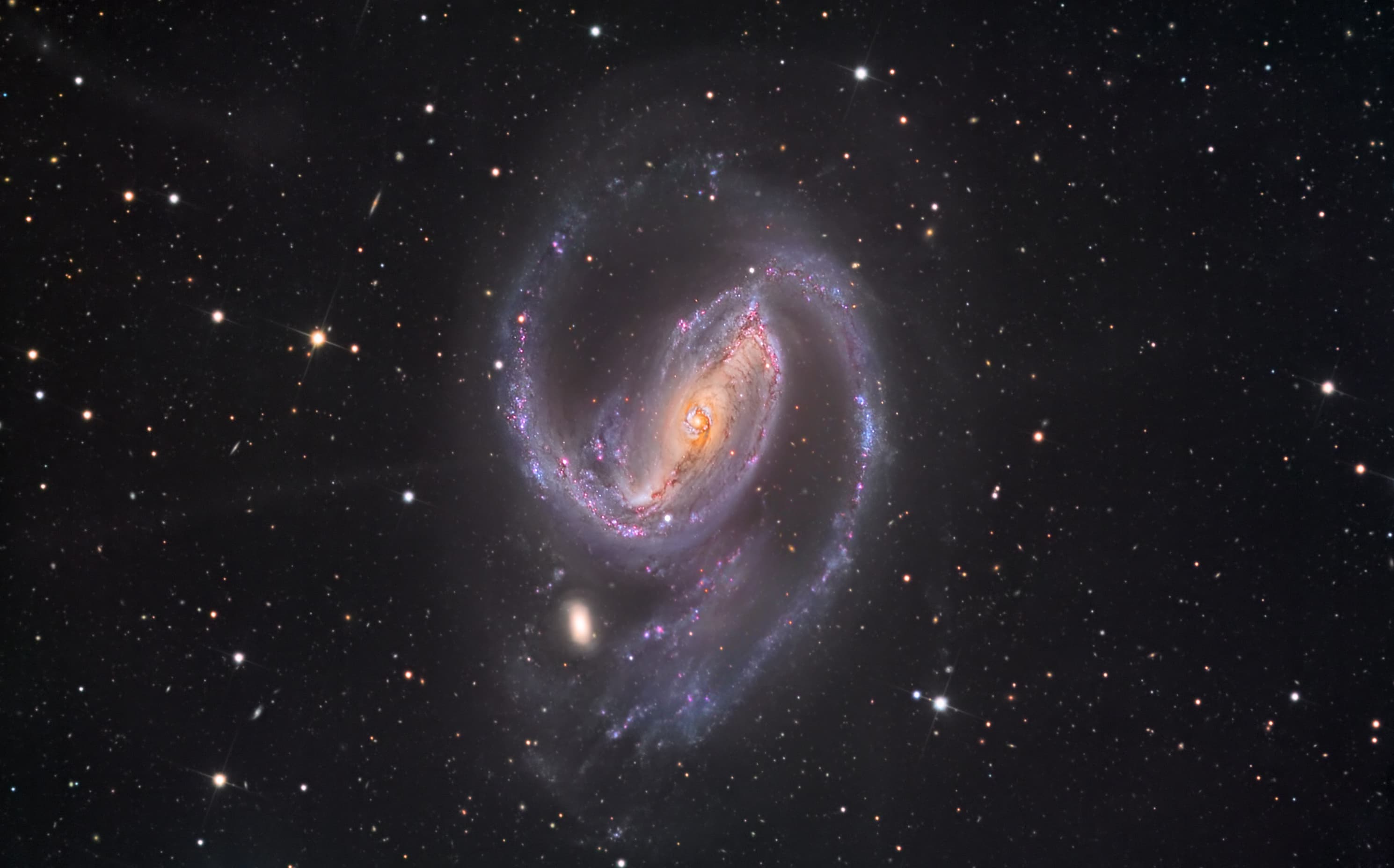 APOD: 2015 January 9 – In the Arms of NGC 1097