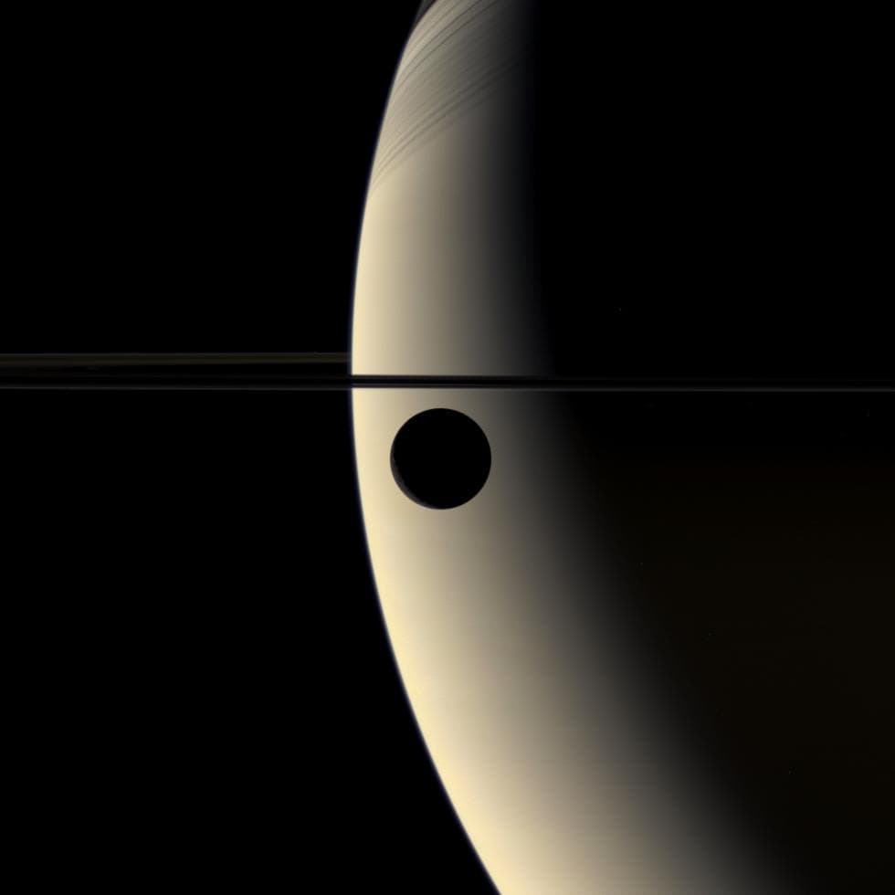 APOD: 2015 January 4 – Crescent Rhea Occults Crescent Saturn