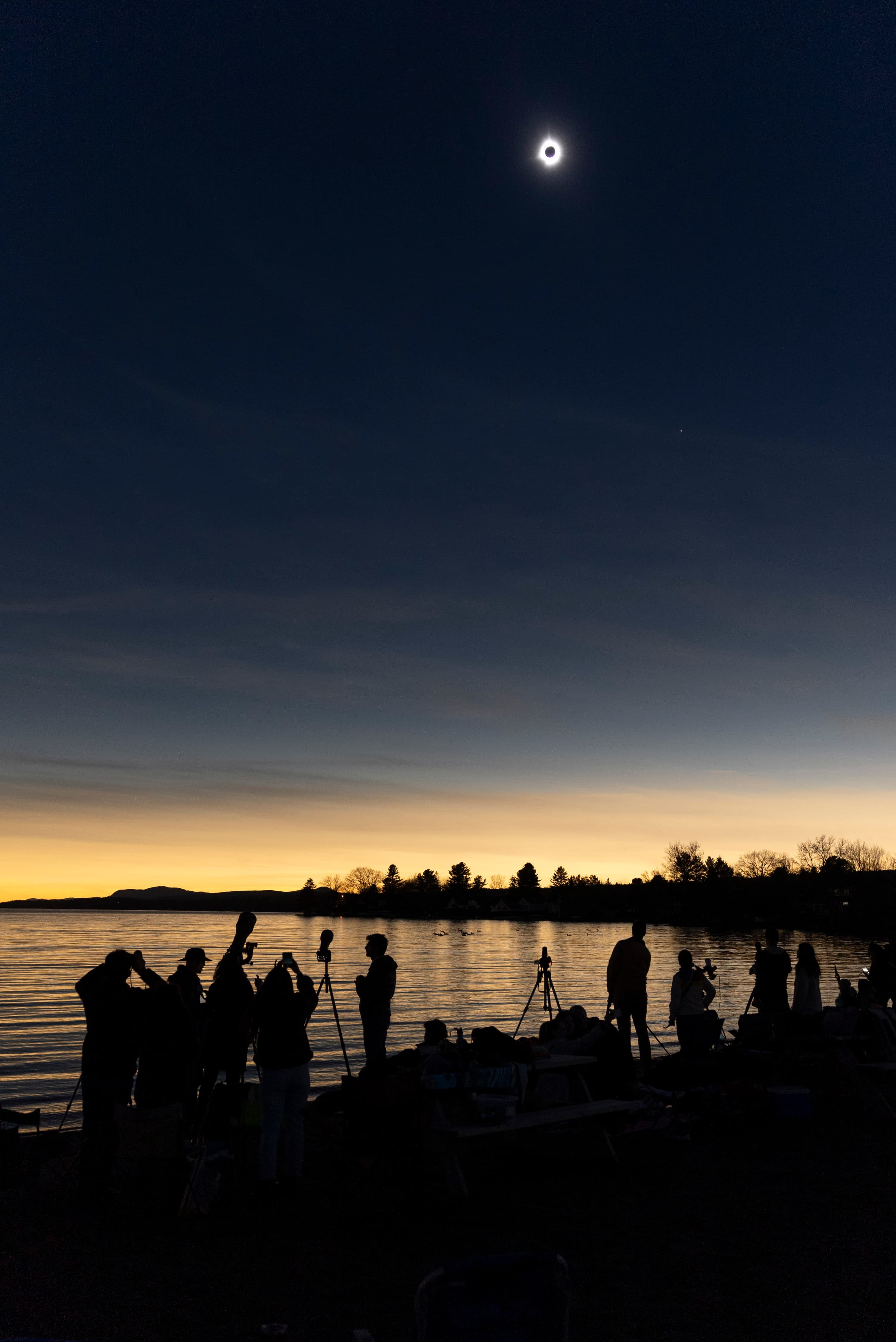 APOD: 2024 April 9 – Moon Shadow over Lake Magog