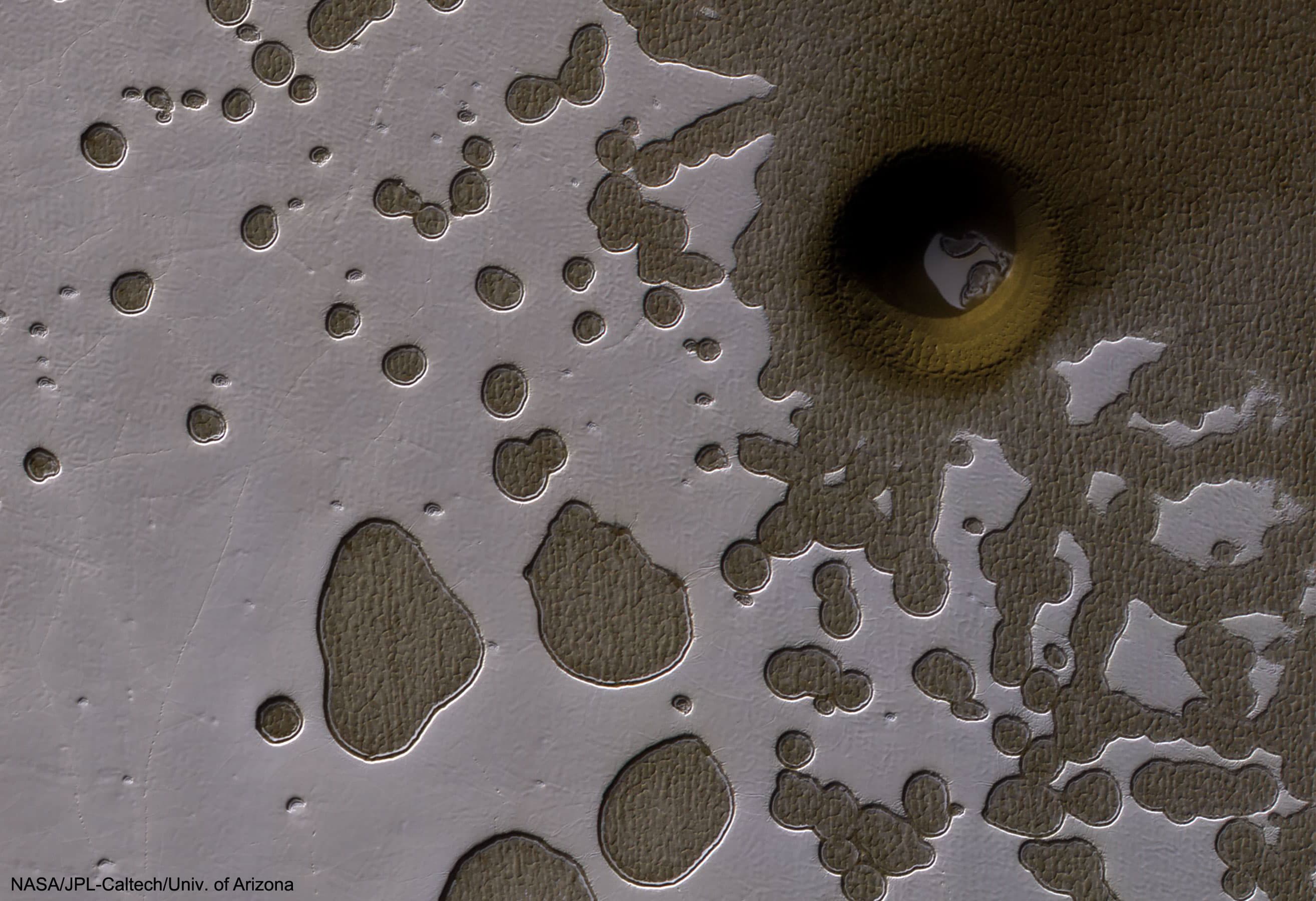 APOD: 2025 April 13 – An Unusual Hole in Mars