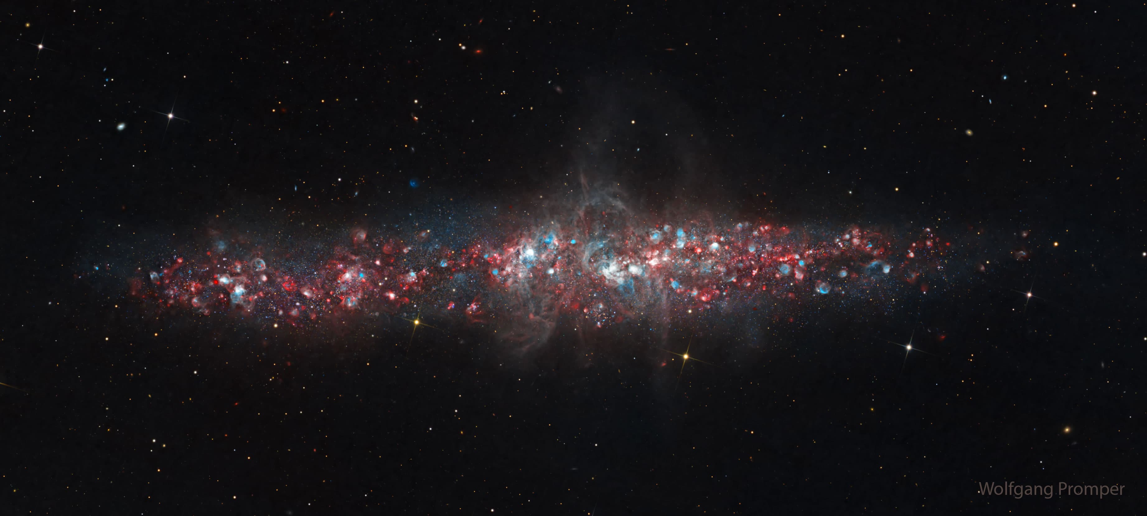 APOD: 2026 January 26 – NGC 55: A Galaxy of Nebulas