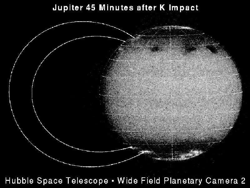 Hubble Sees Auroral Emission Arcs Following the k Impact