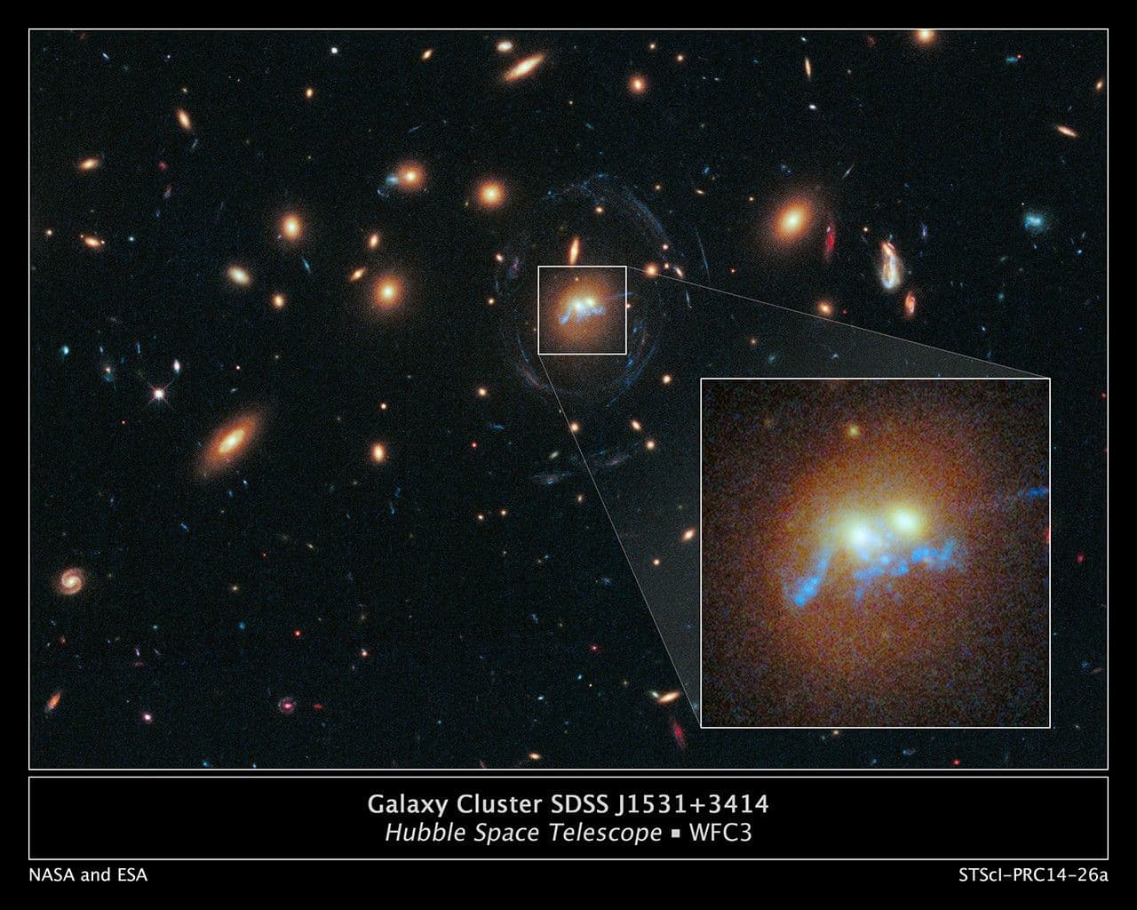 Hubble Sees Spiral Bridge of Young Stars Between Two Ancient Galaxies