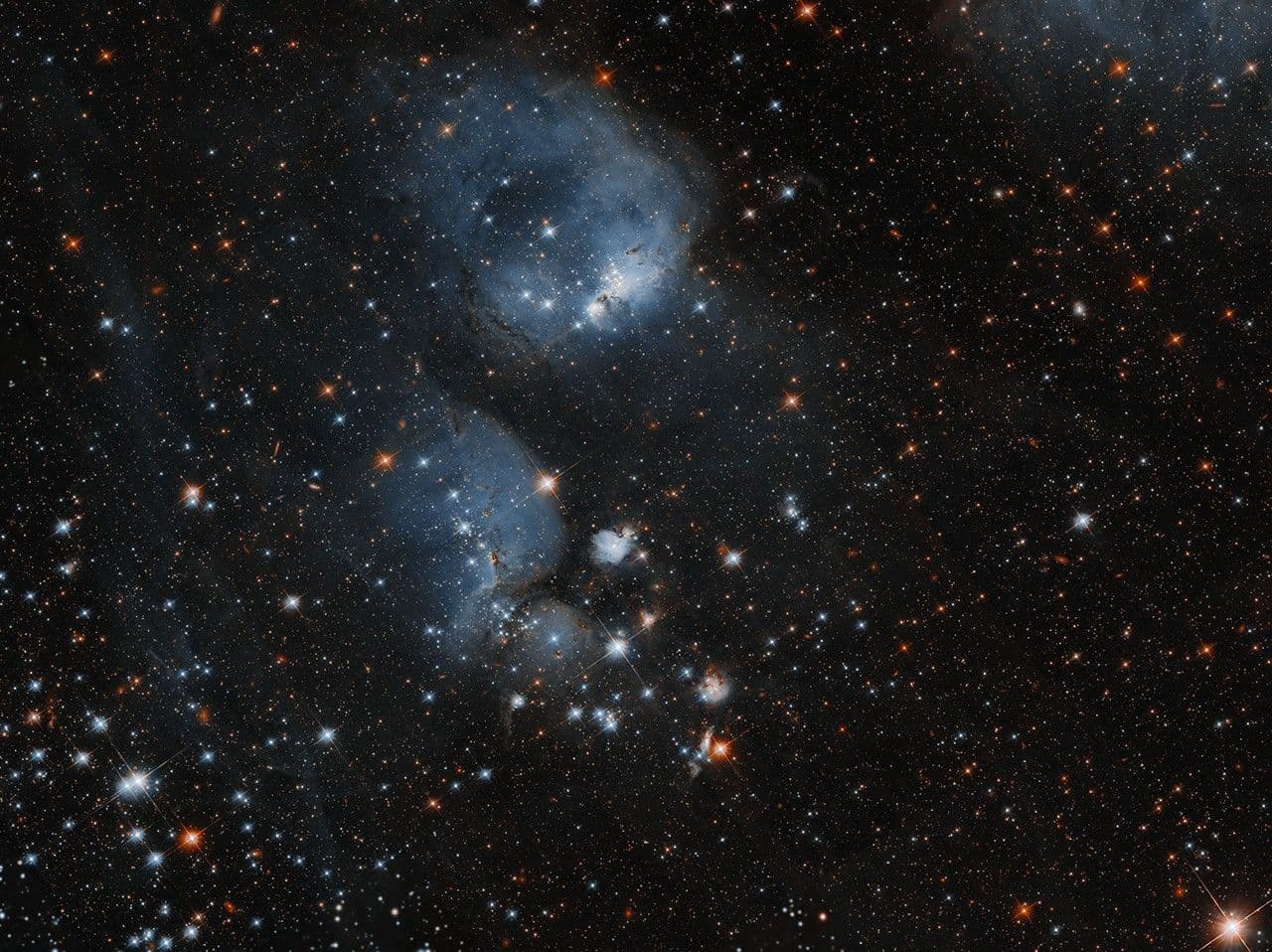 Hubble Examines Stars Ensconced in a Cocoon of Gas