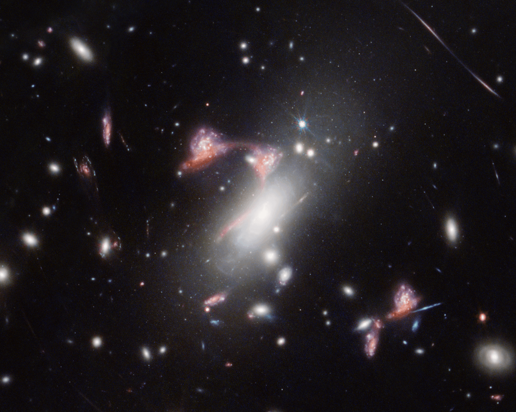 NASA’s Webb Reveals Distorted Galaxy Forming Cosmic Question Mark