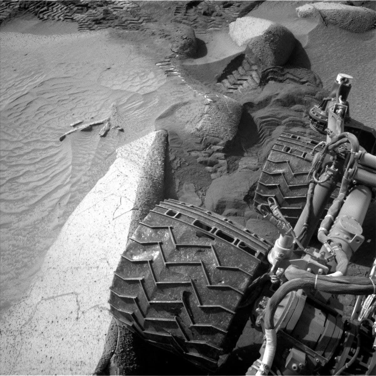 Sols 3848-3850: Boulder, Meet Wheel