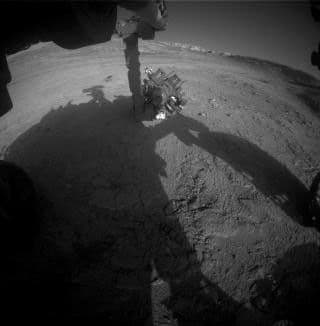 Curiosity Works Its Robotic Arm During Sunset