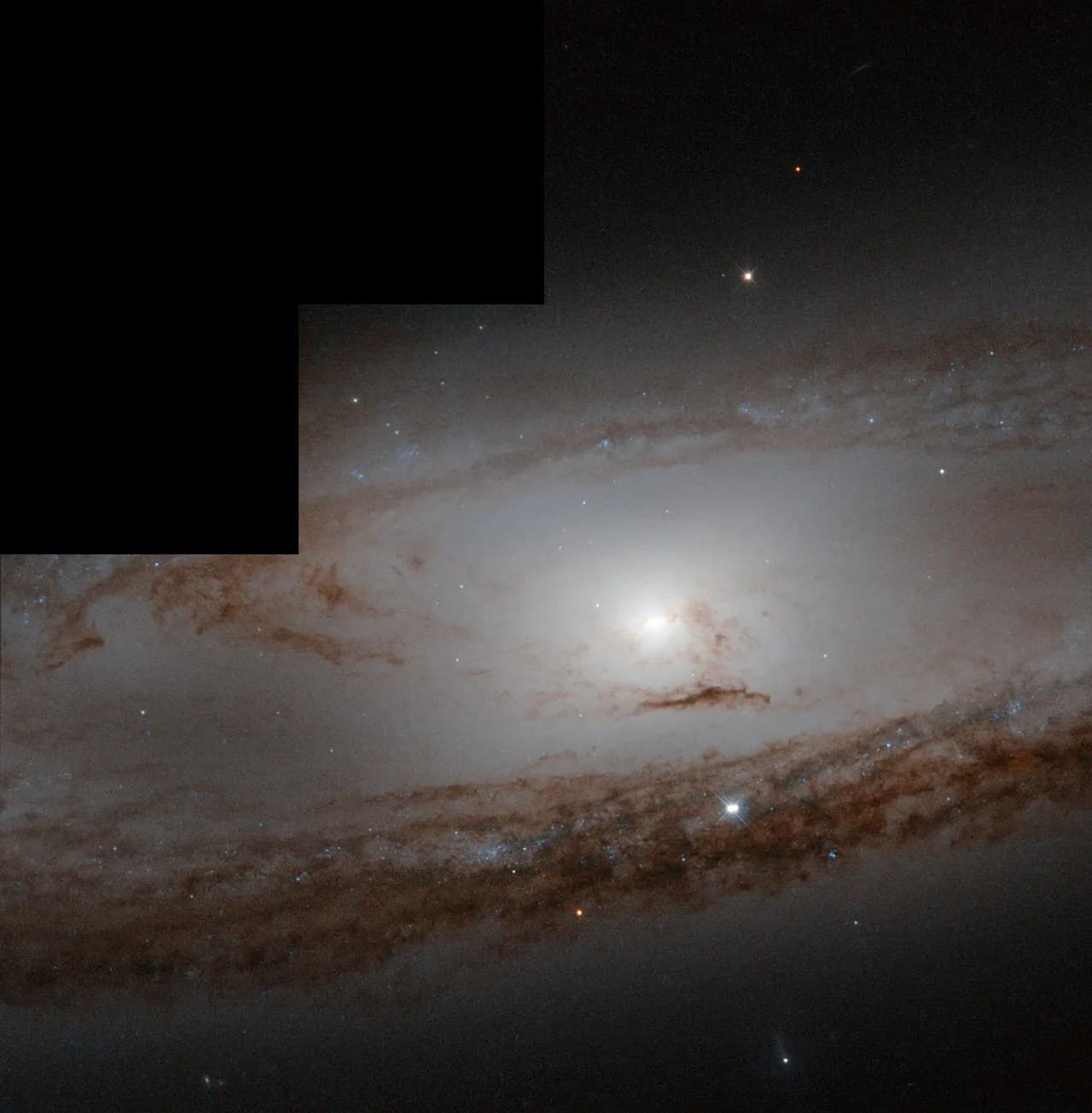 Hubble Looks At Messier 65 and Its History